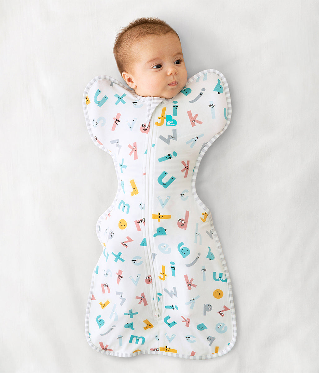 Love To Dream Swaddle UP Ecovero Moderate, Medium - Alphabet Soup White